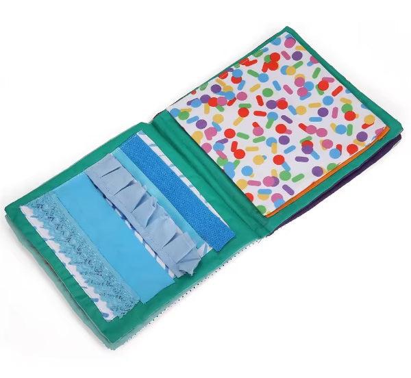 Interaktív textil fejlesztő könyv babáknak